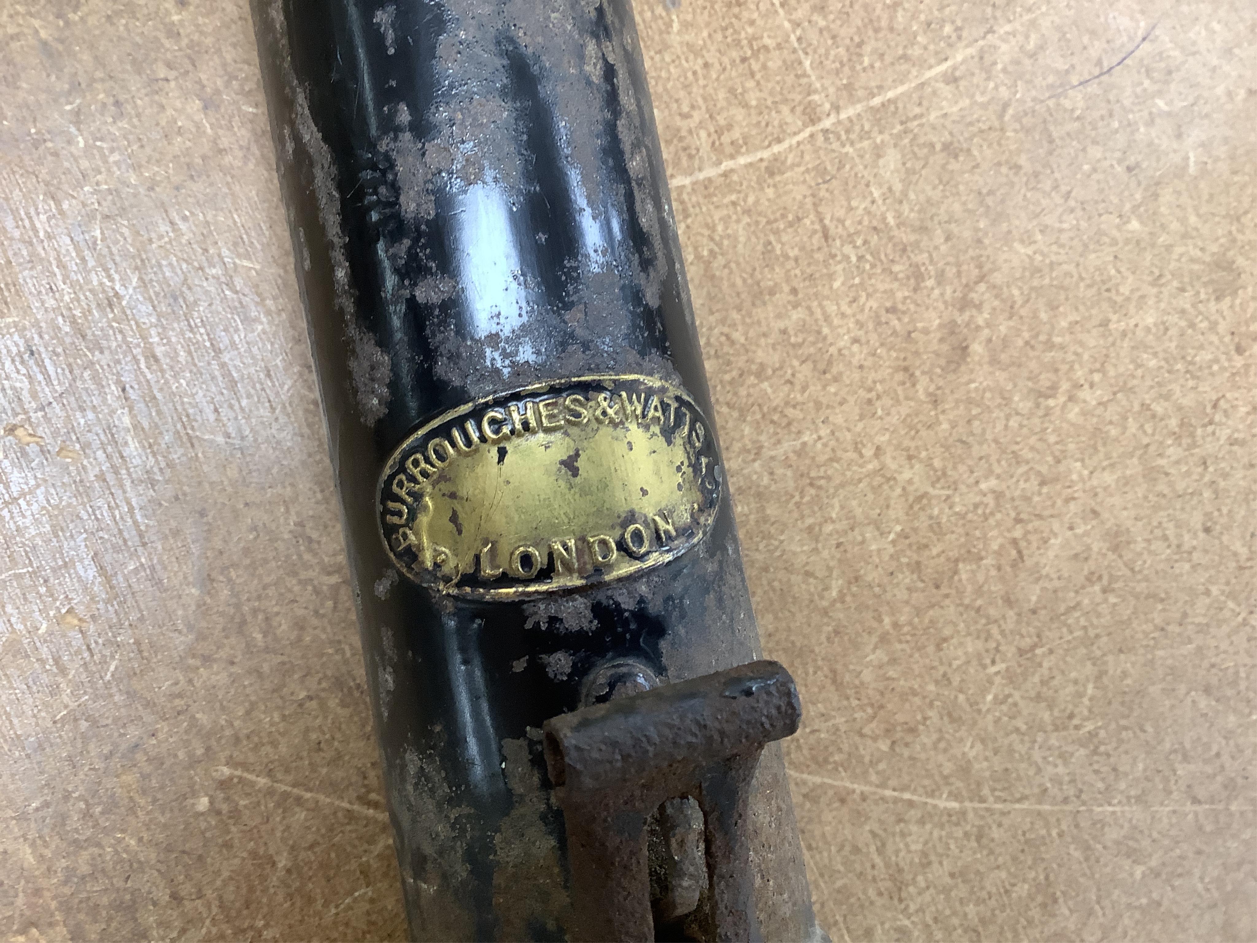 A collection of tribal spears, a fish hook, a cased snooker cue, etc.